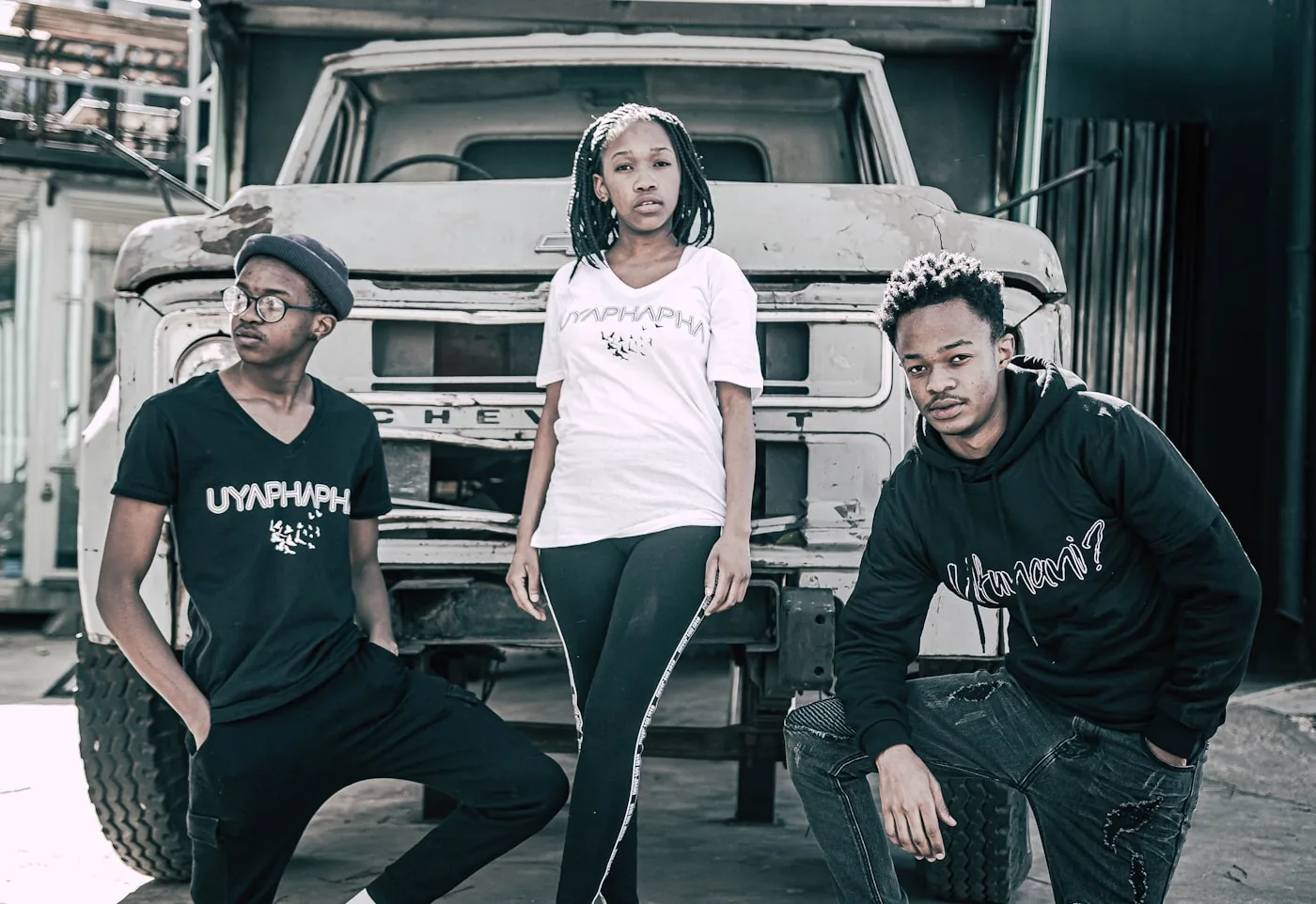 Three young creatives photographed together on location