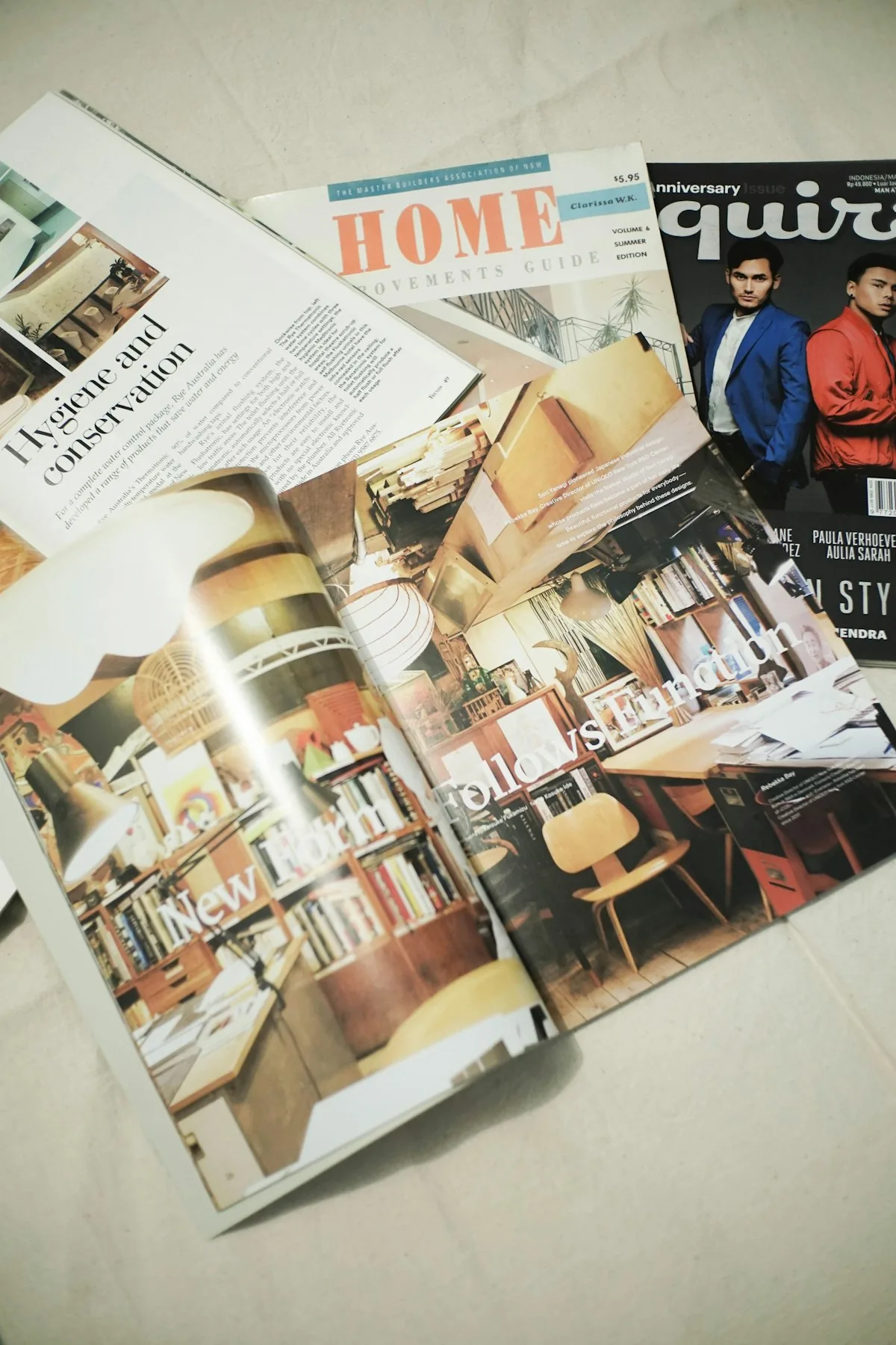 Assorted printed magazines fanned out on a surface