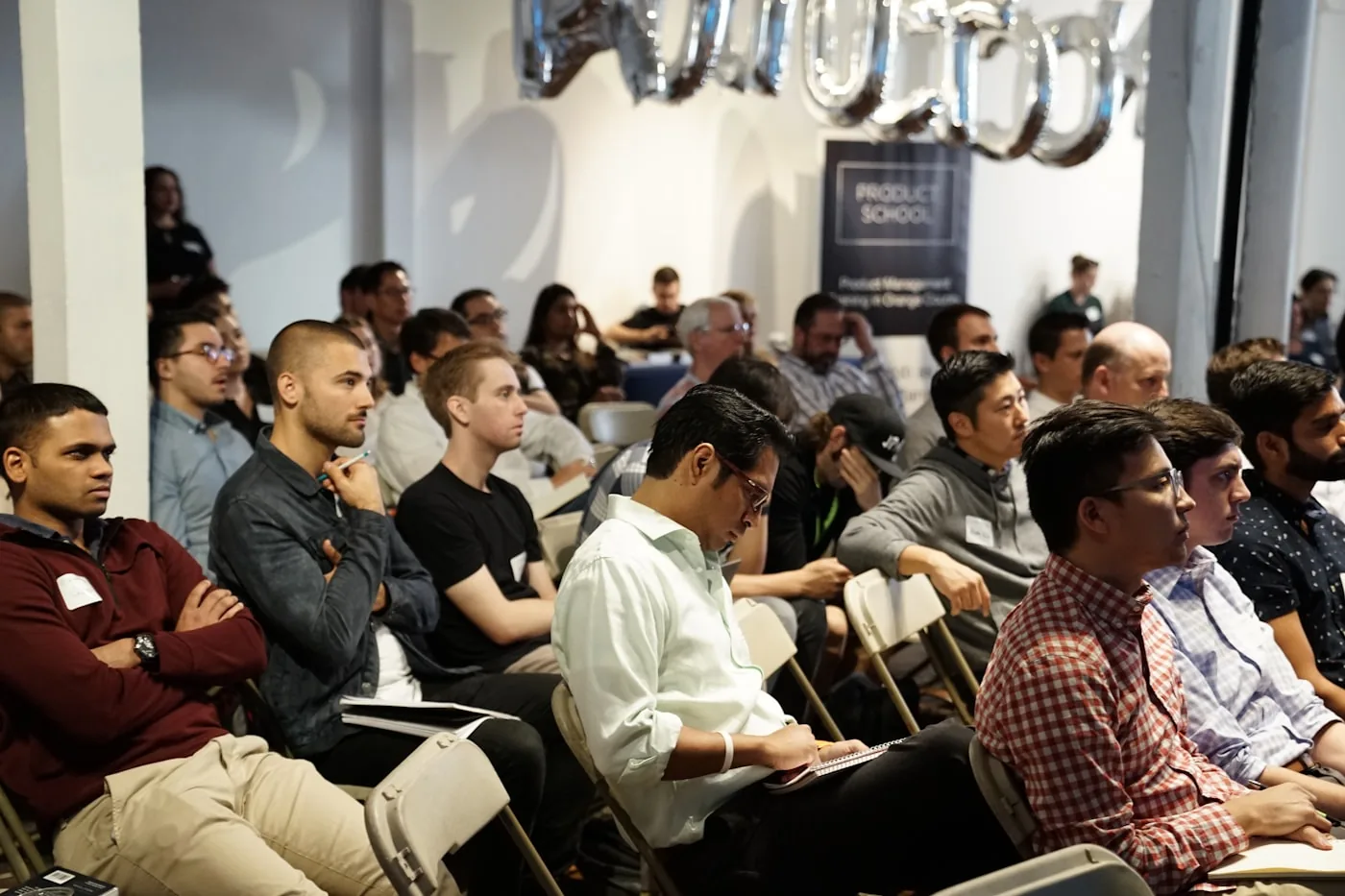An attentive, diverse audience at a public knowledge-sharing session