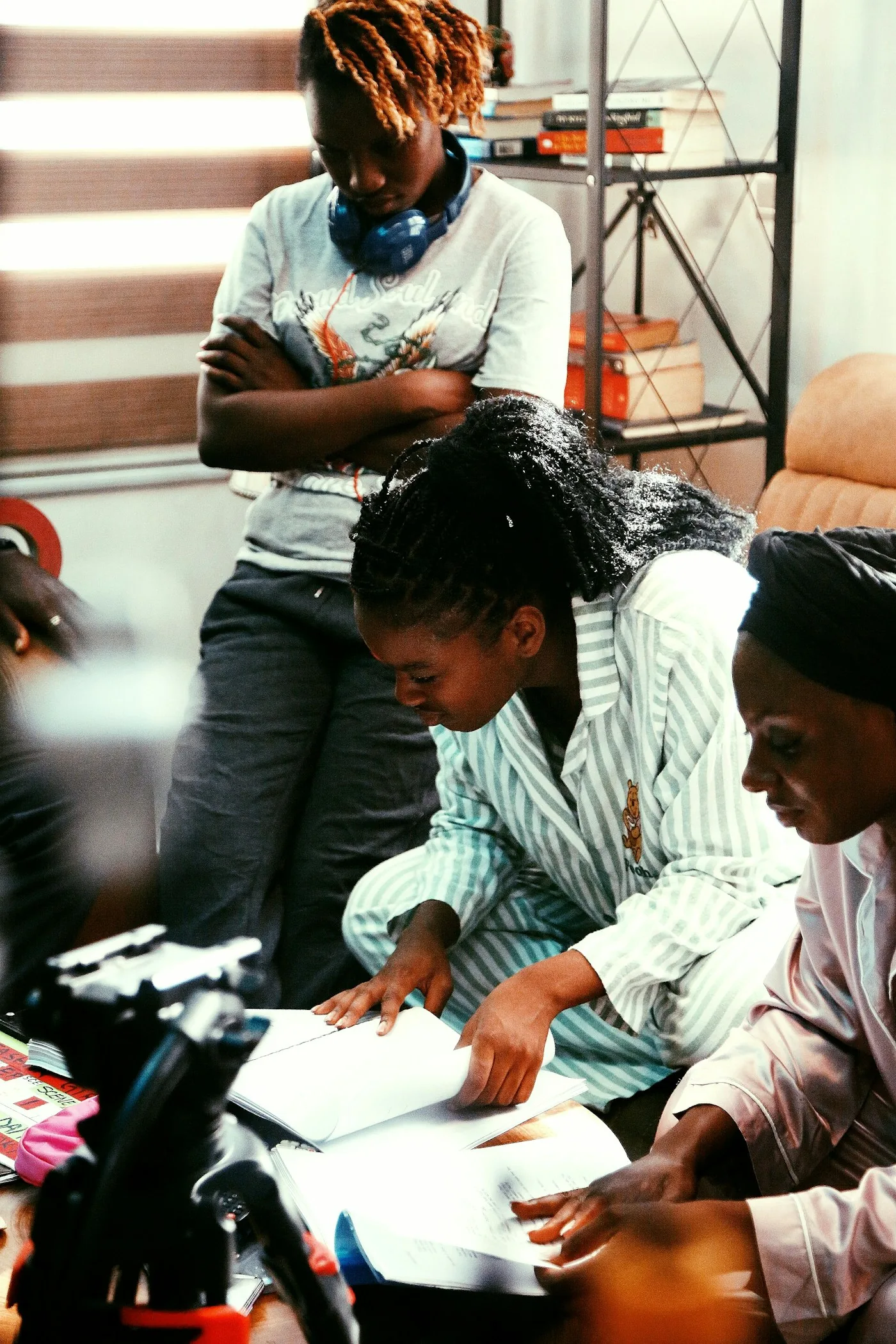 Three women reviewing documents together during an interview